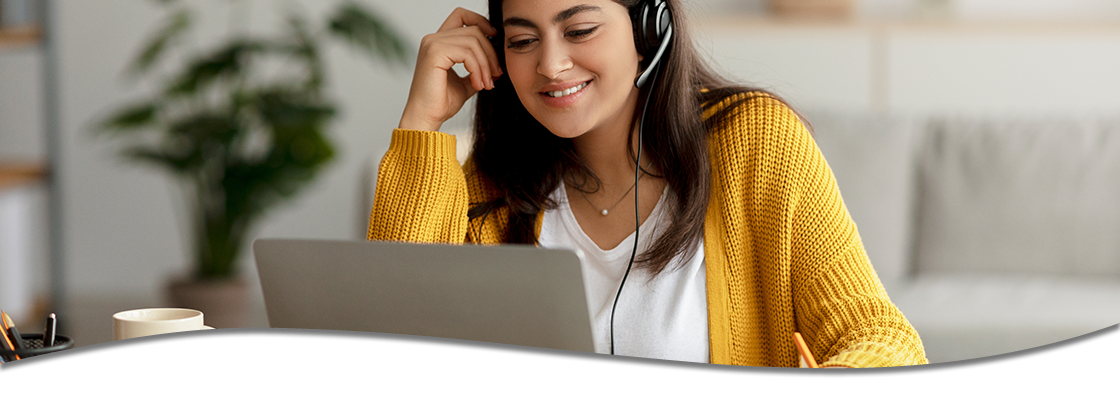 Woman on headset and laptop