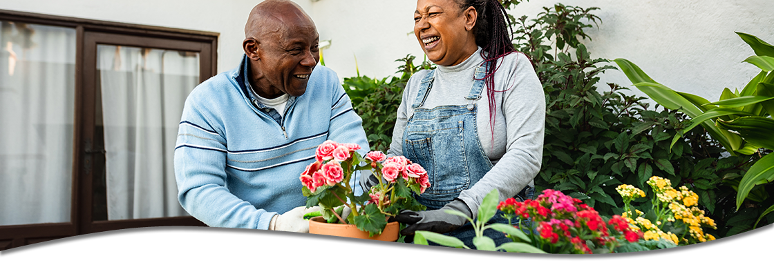 Man and woman planting flowers