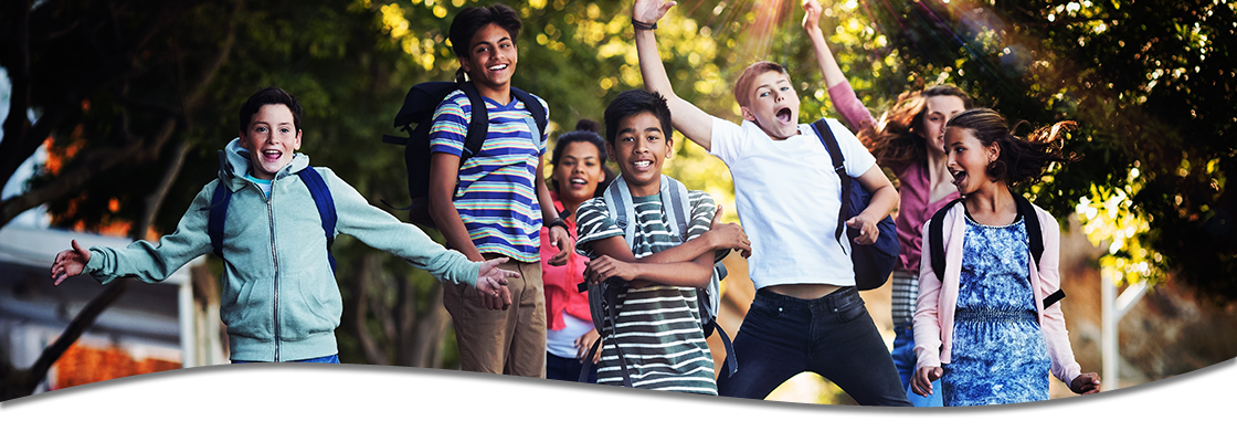 Group of young adults jumping and acting goofy